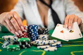 Sic Bo table layout showing dice outcomes and betting zones with live dealer hands